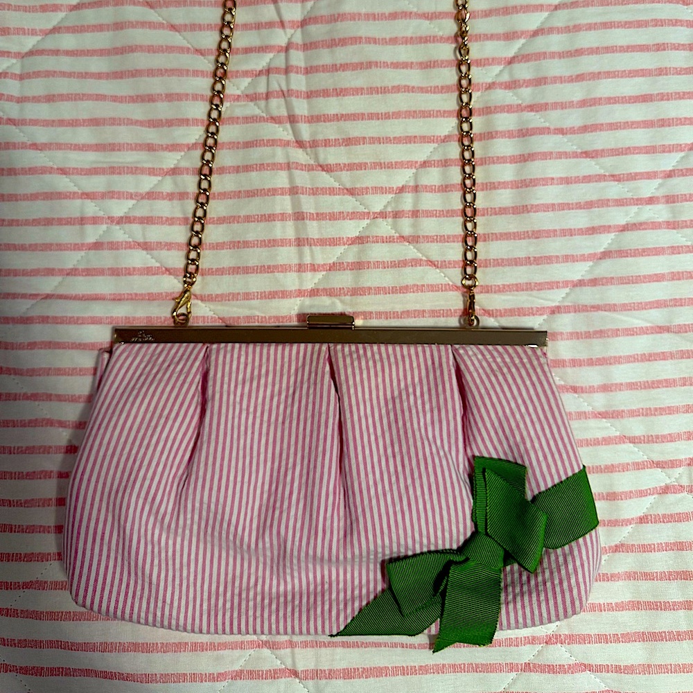 Lilly Pulitzer clutch w/ chain. Beautiful pink stripe w/ green bow. Gold accents